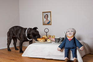 Theresa May dog toy enjoying afternoon tea with a dog